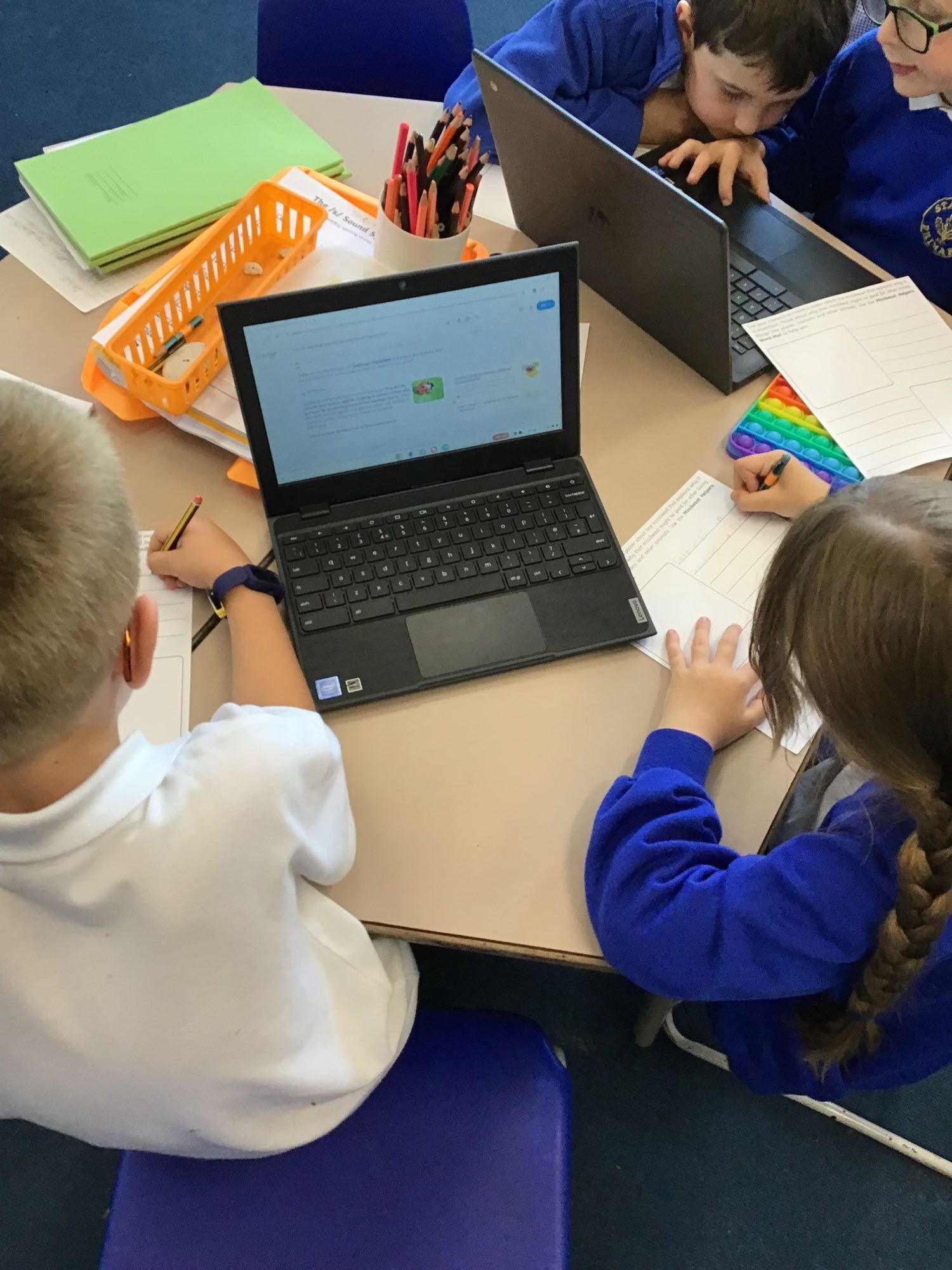 Children researching on chromebooks