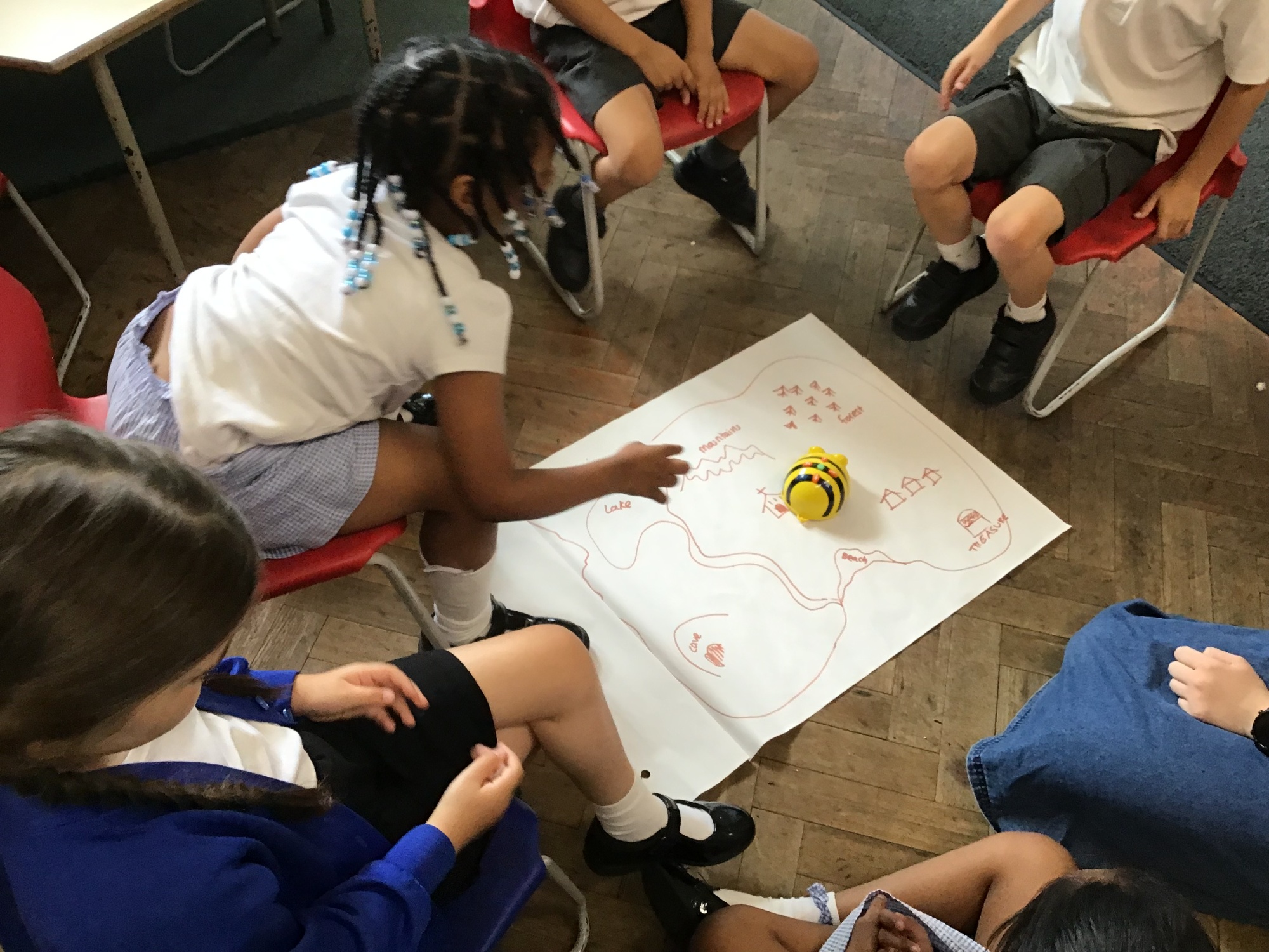 Children using Beebots