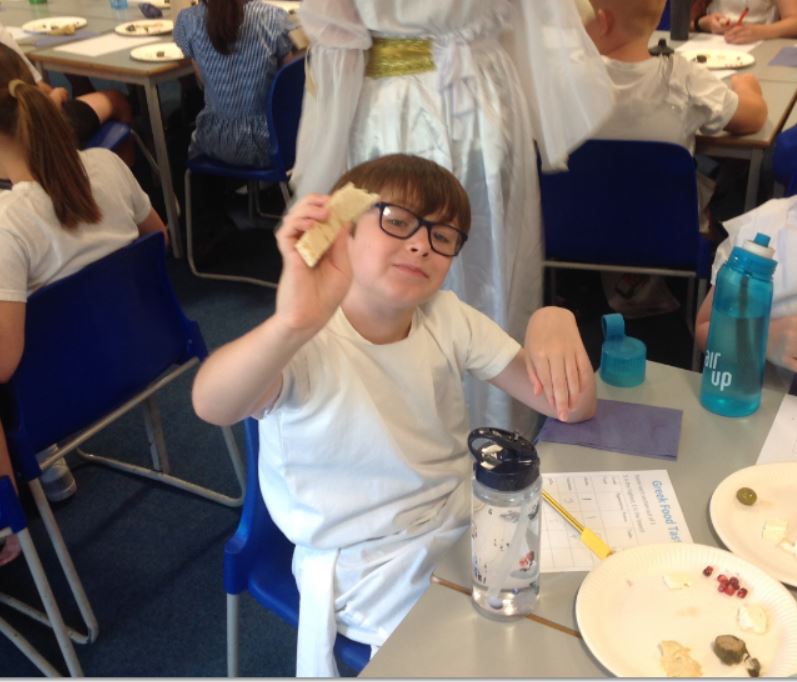 boy and greek food