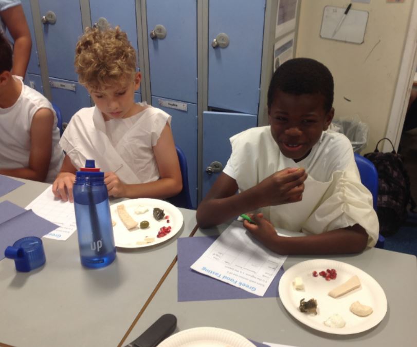 boy eating Greek food