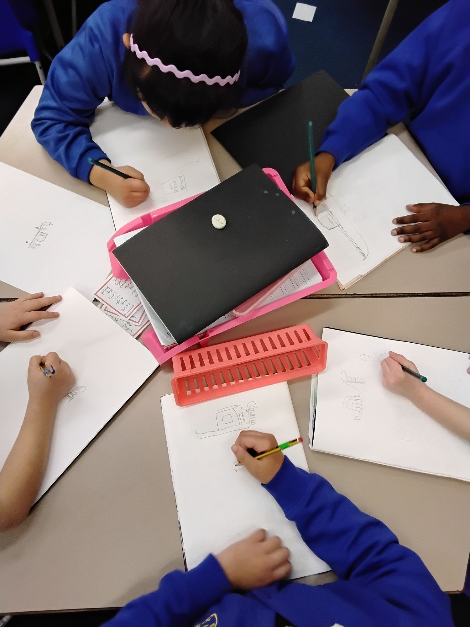 Children drawing a picture of a gondola
