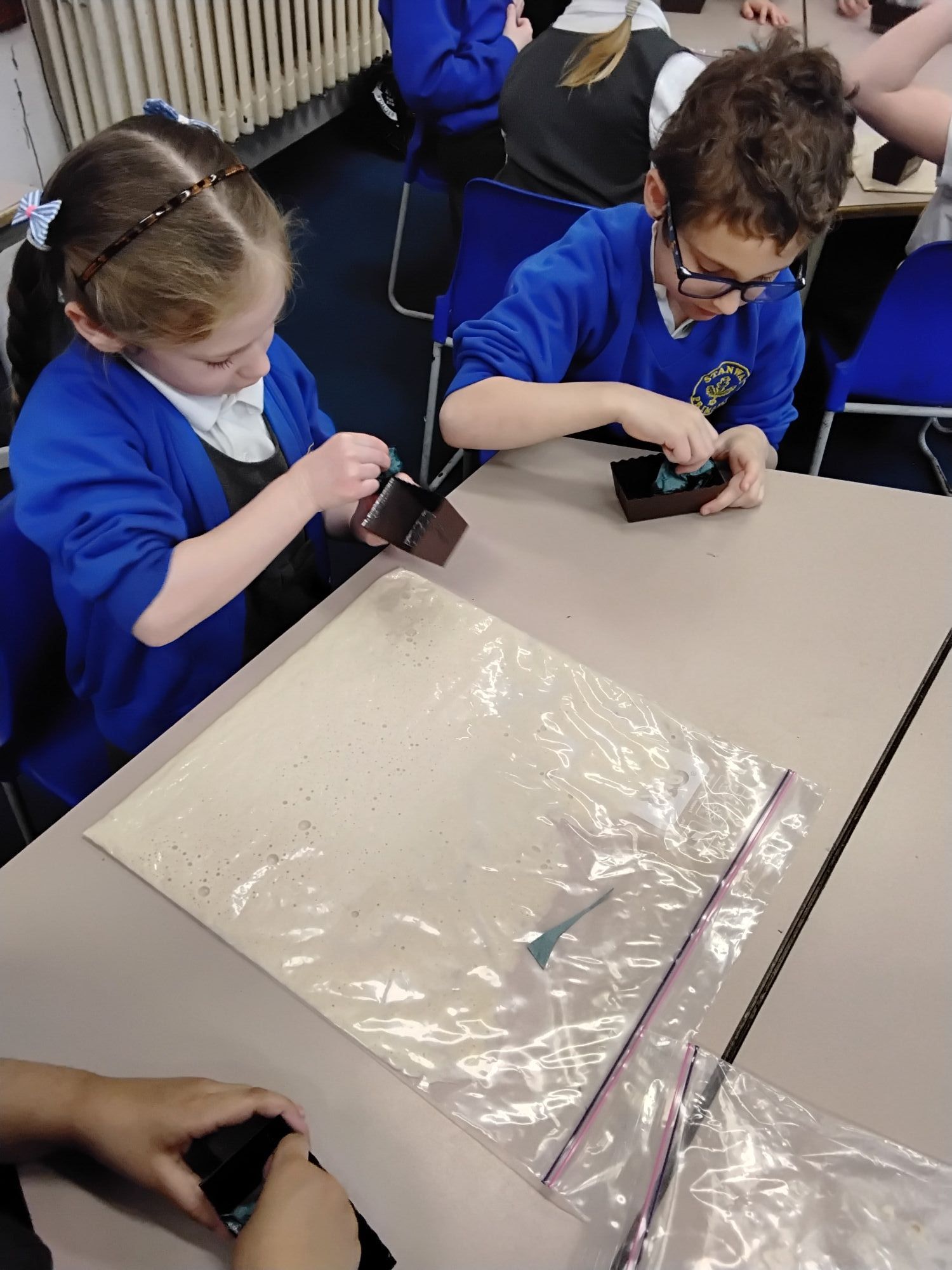Making bread in a bag - greasing the bread tins
