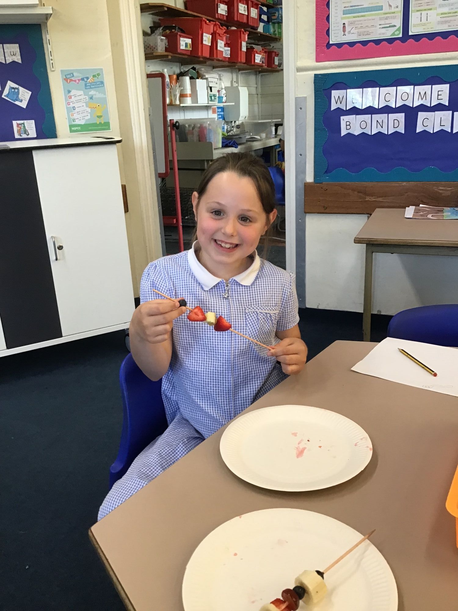 Enjoying her fruit kebab made in DT