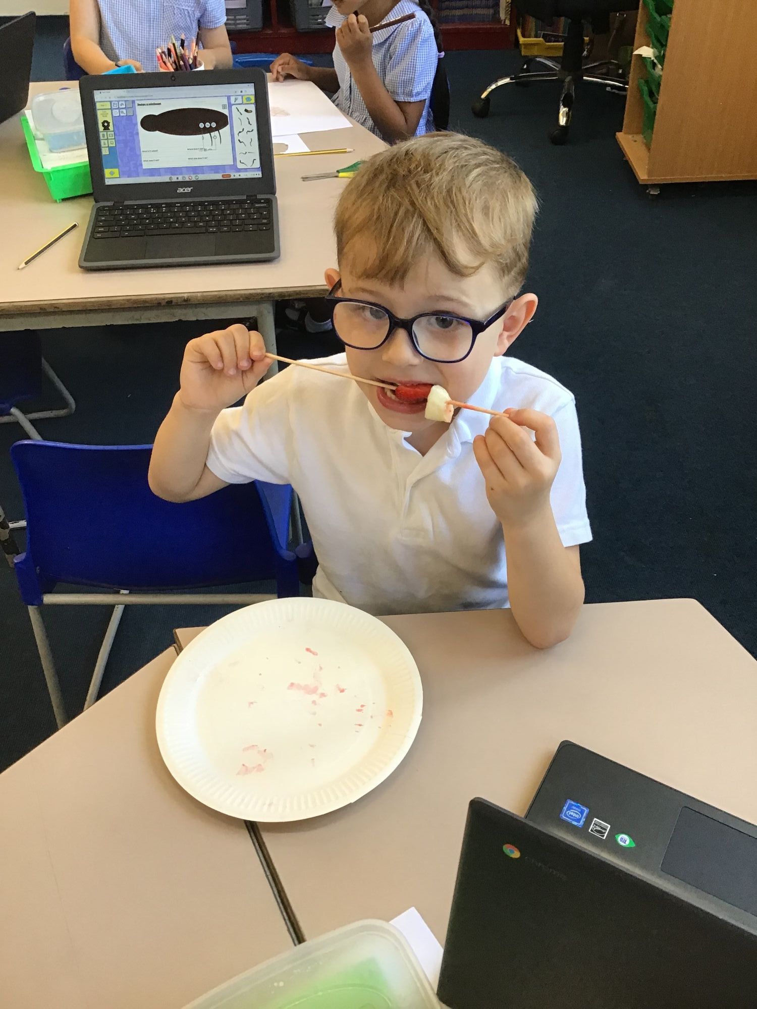 Enjoying his fruit kebab made in DT