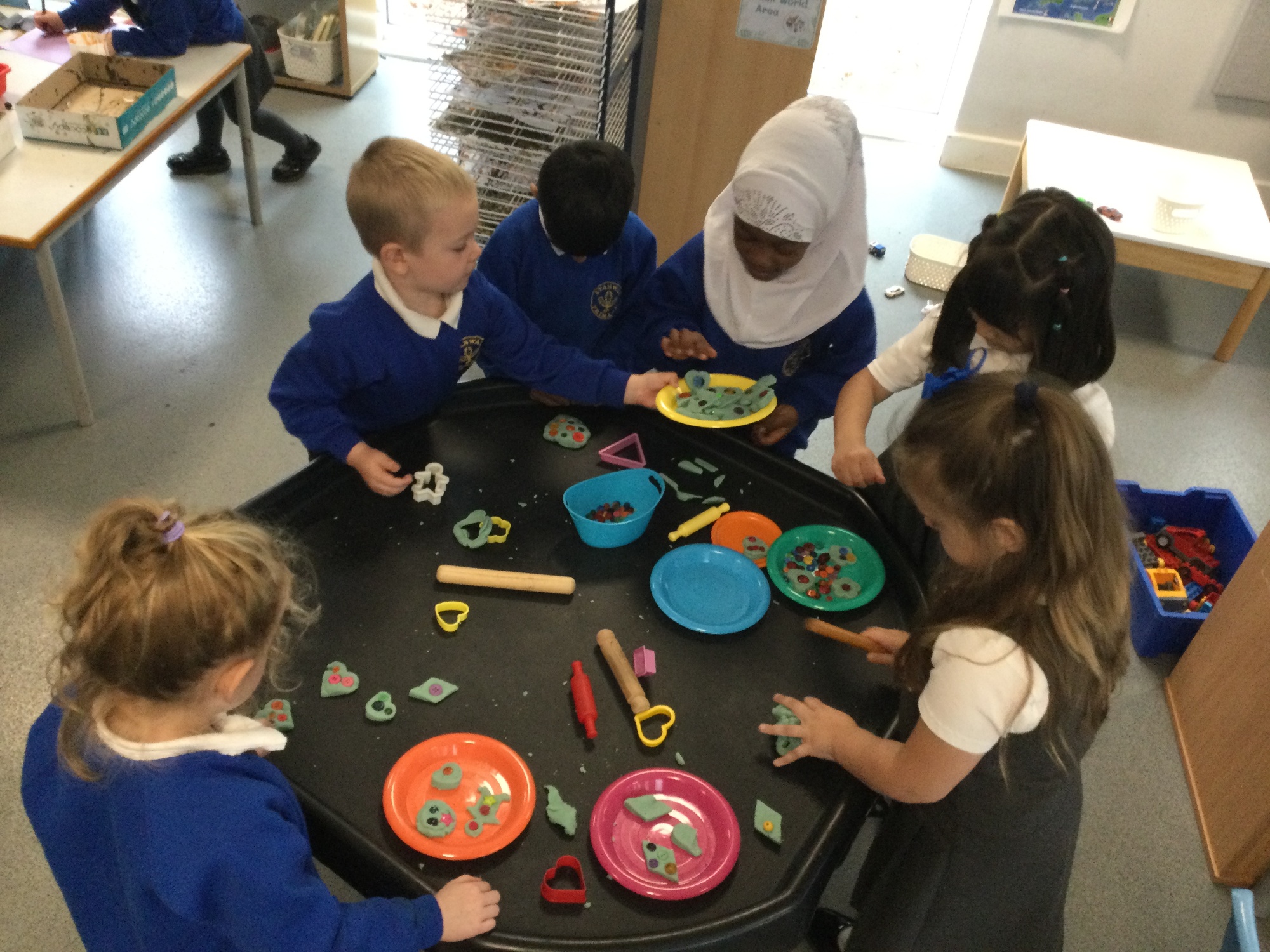 Children decorating play-doh