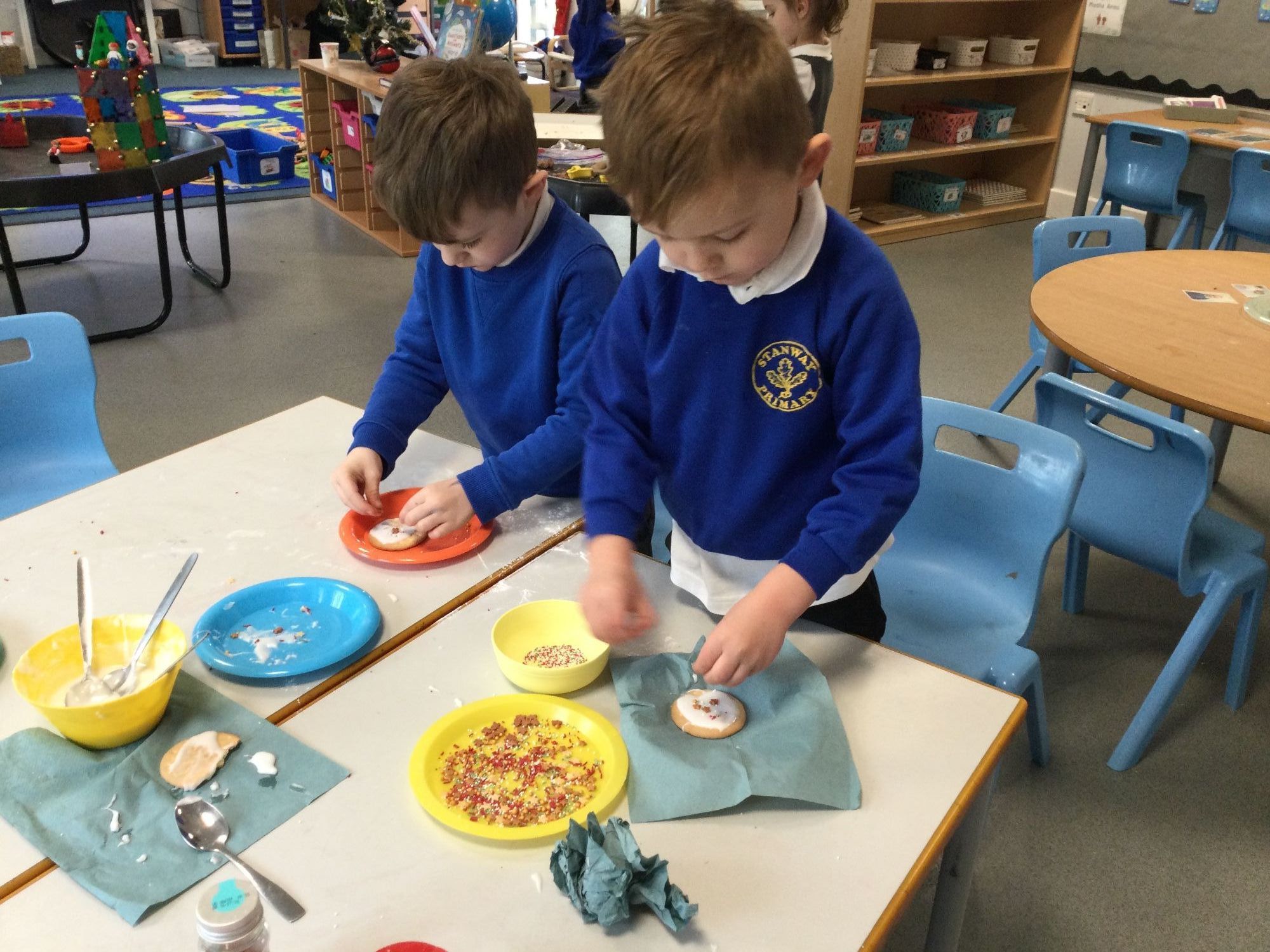 Children decorating biscuits