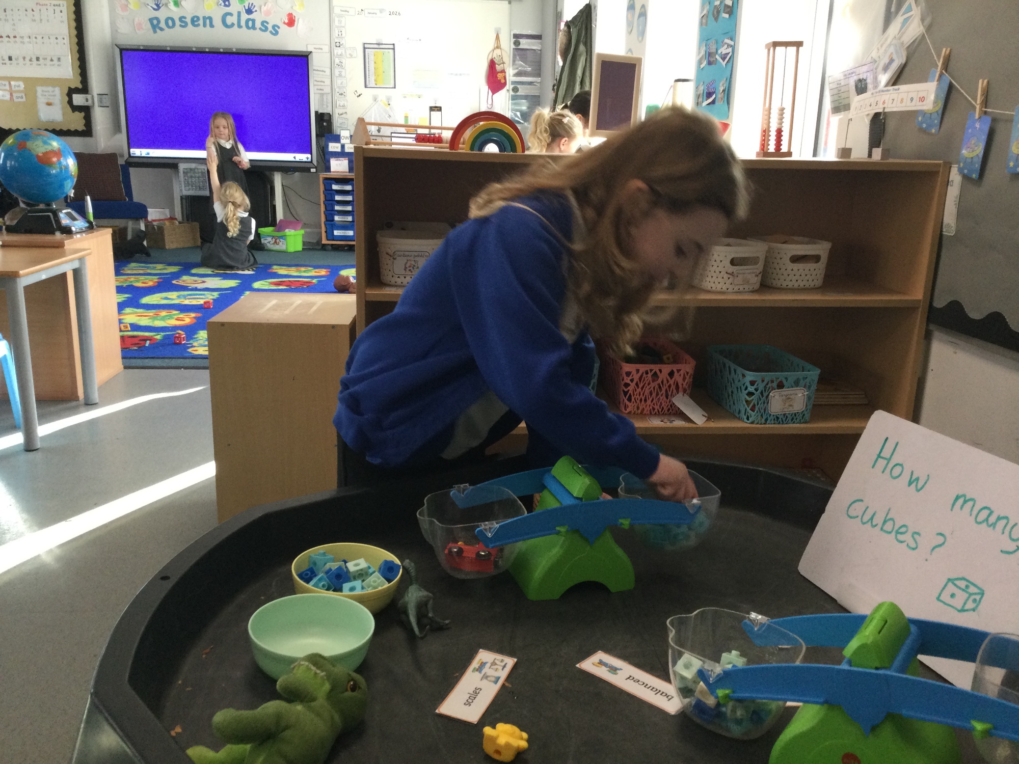 Children using balance scales