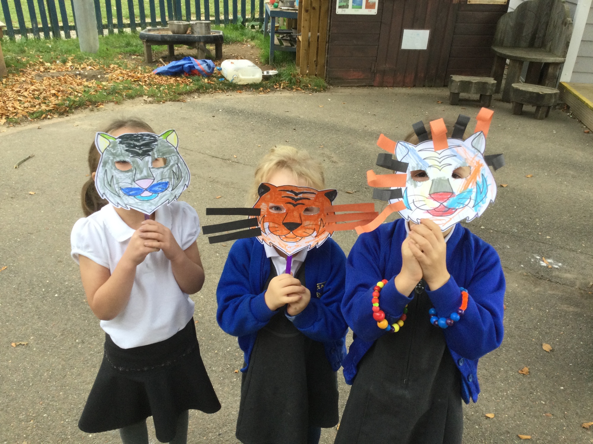Children showing their masks