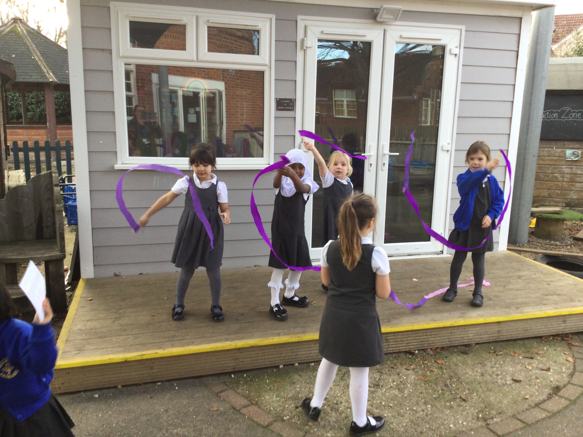 Children using streamers to practise different movements