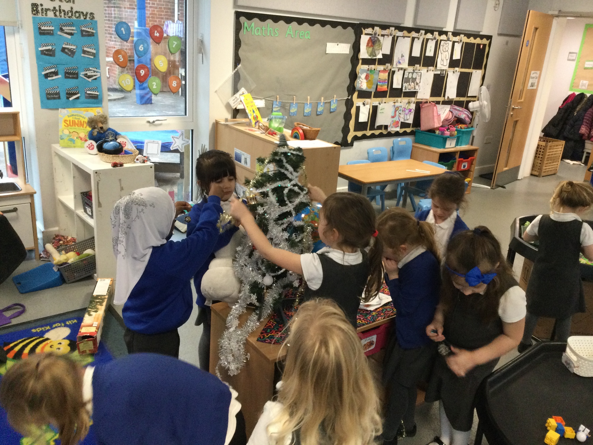 Children decorating christmas tree