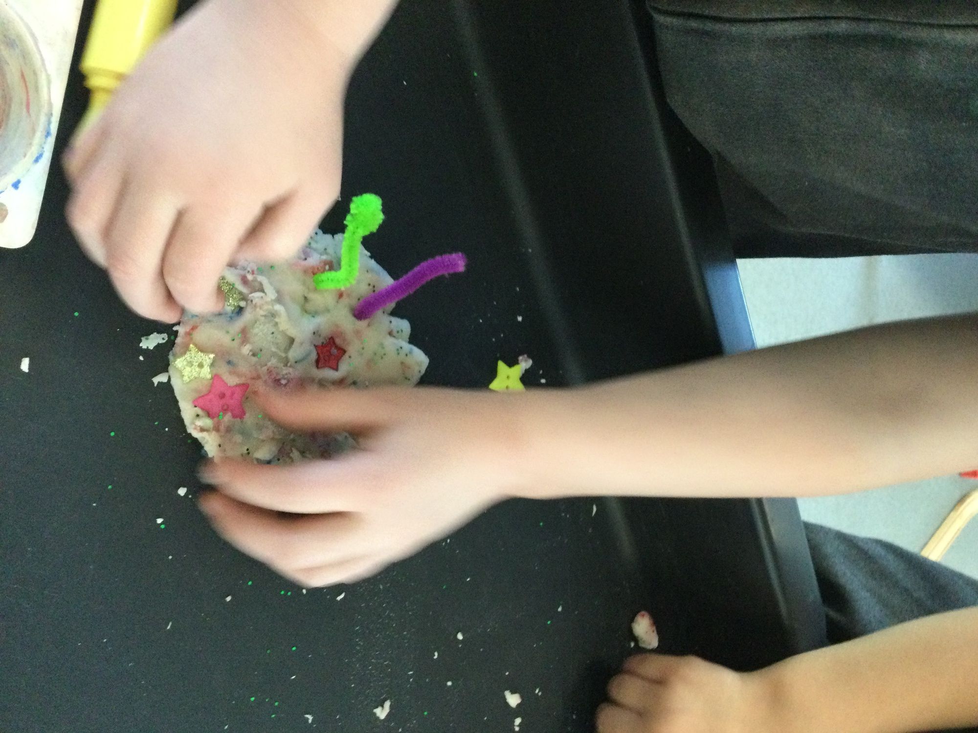 Child playing with play dough